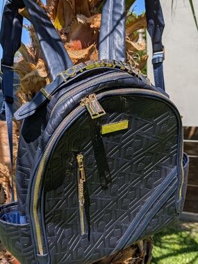 Tote & Carry Black Embossed Backpack with Gold Hardware